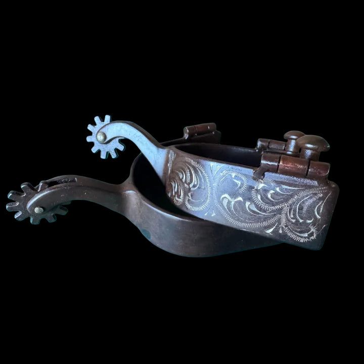 Brown steel spurs with silver flower