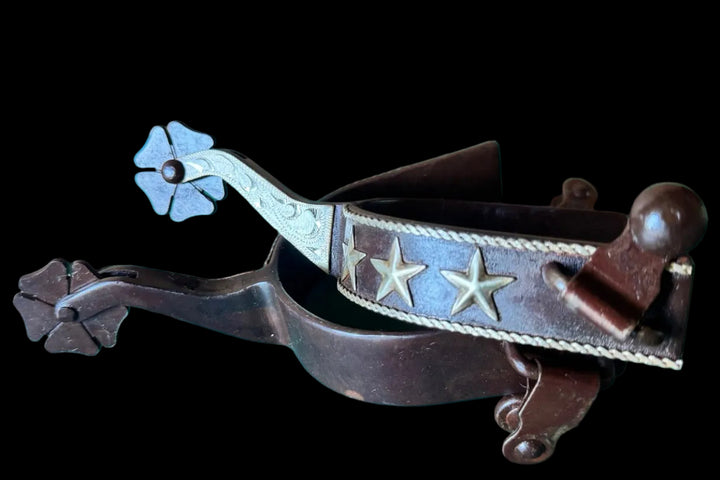 Brown steel lady spurs with silver rope and stars